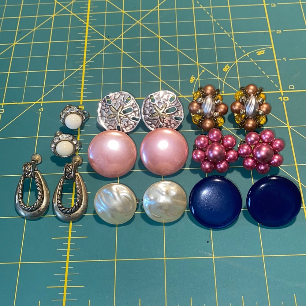 Collection of clip and screw back earrings.